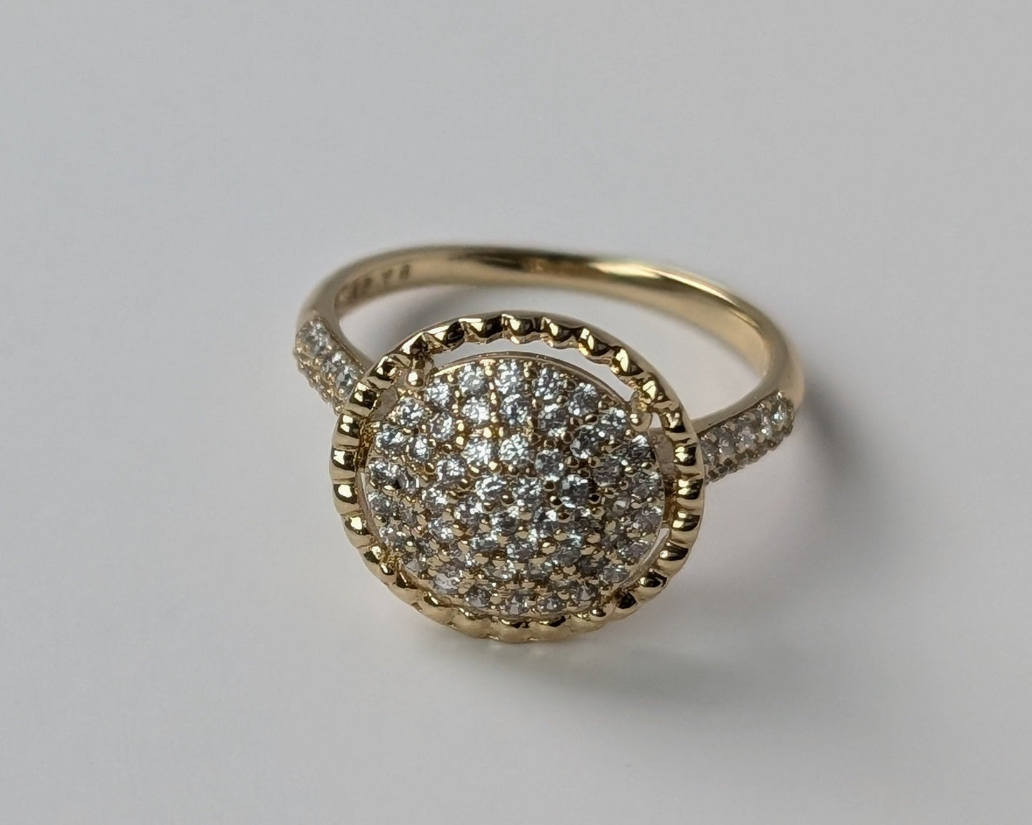 Gold ring with diamond-like stones