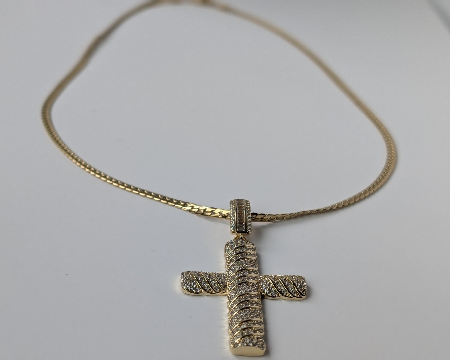 Gold cross pendant on a chain 