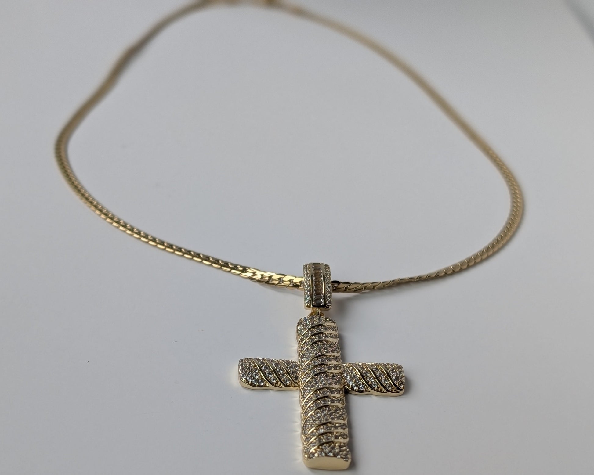 Gold cross pendant on a chain 