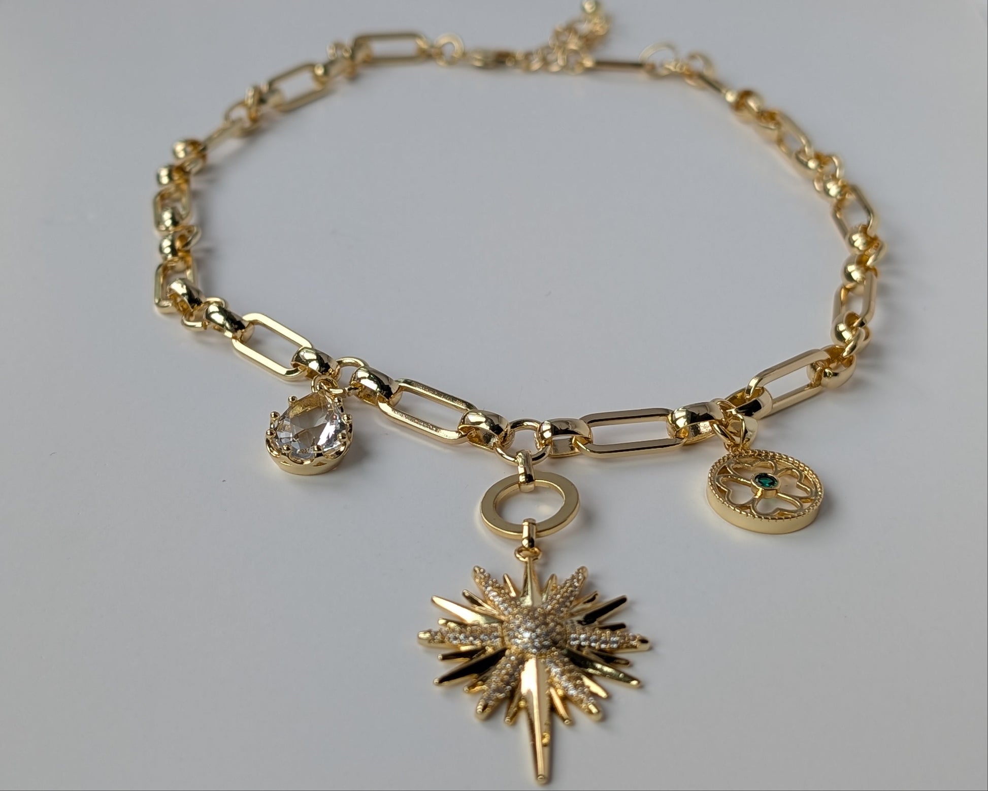 Gold necklace with charms 