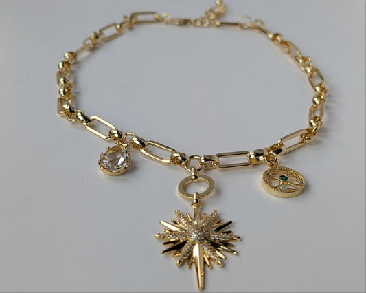 Gold necklace with charms 