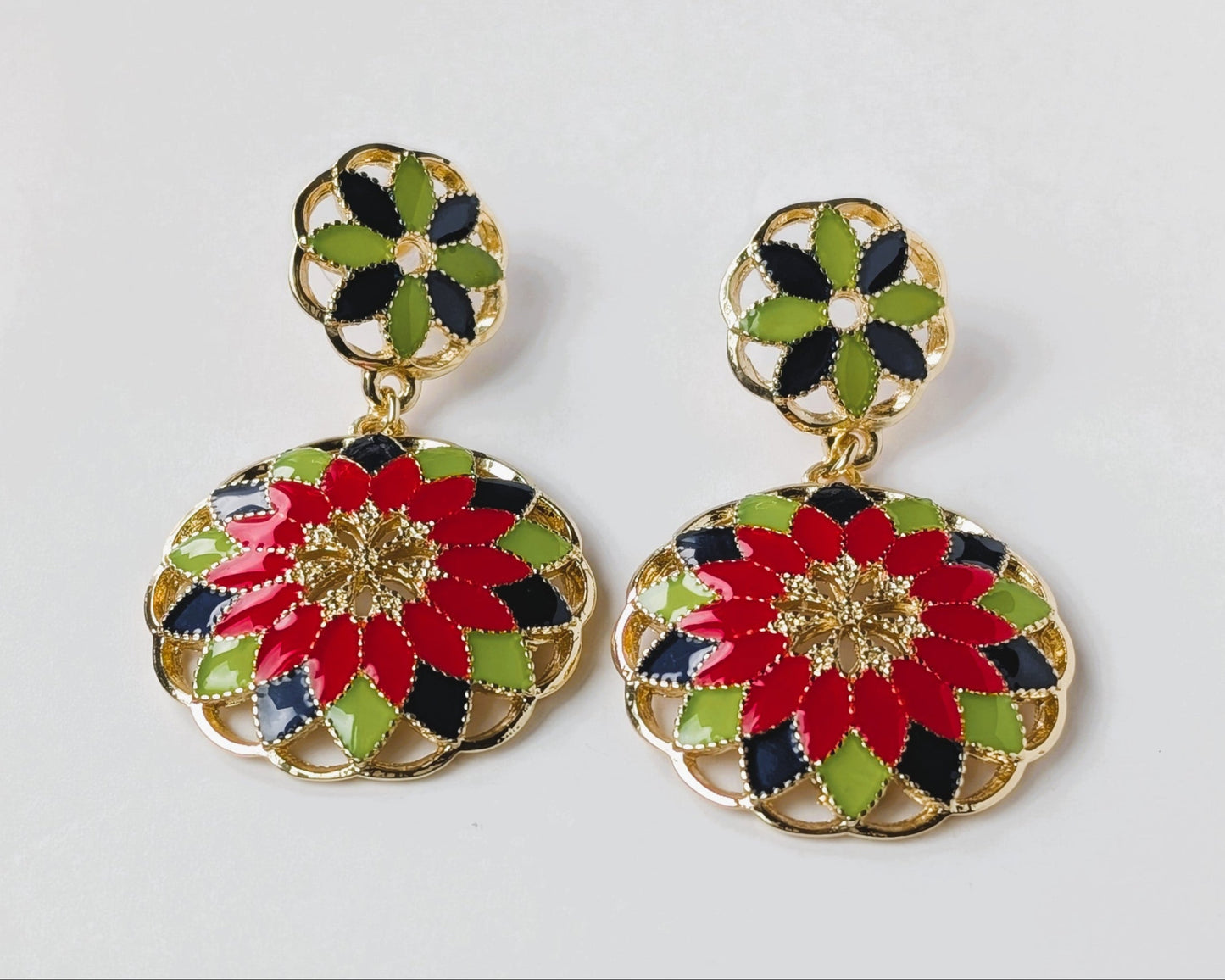 Colorful floral earrings on a light gray background