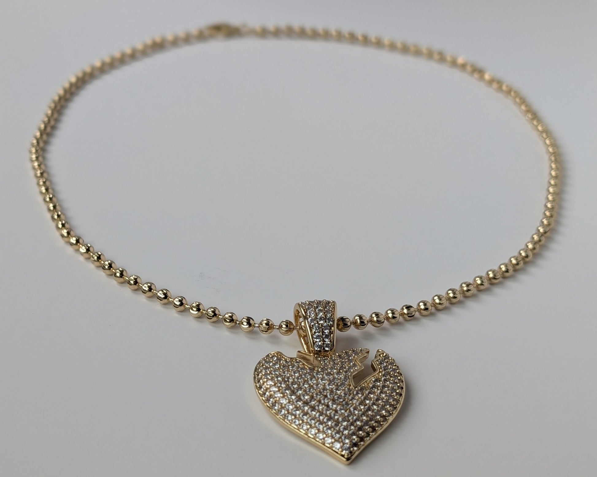 Gold necklace with a heart-shaped pendant
