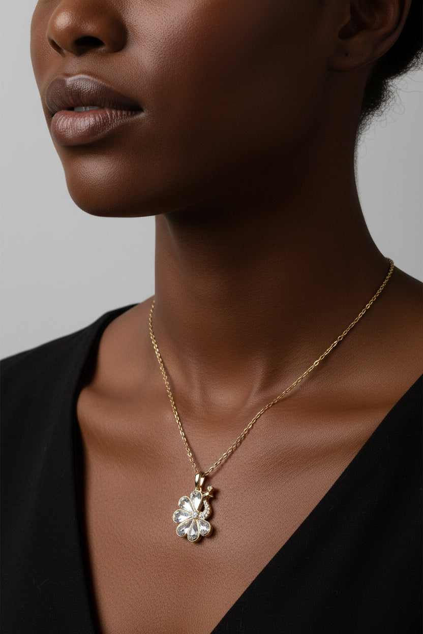 Gold necklace with a peacock crystal pendant 